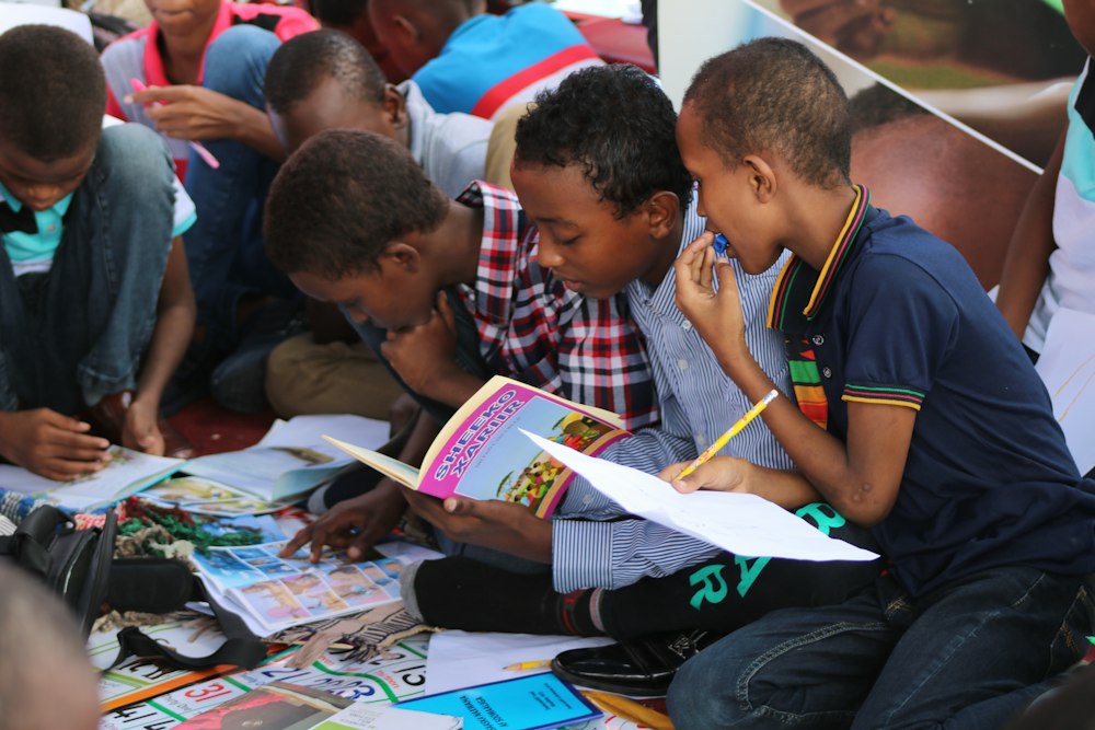 Pupils reading books together in the school library